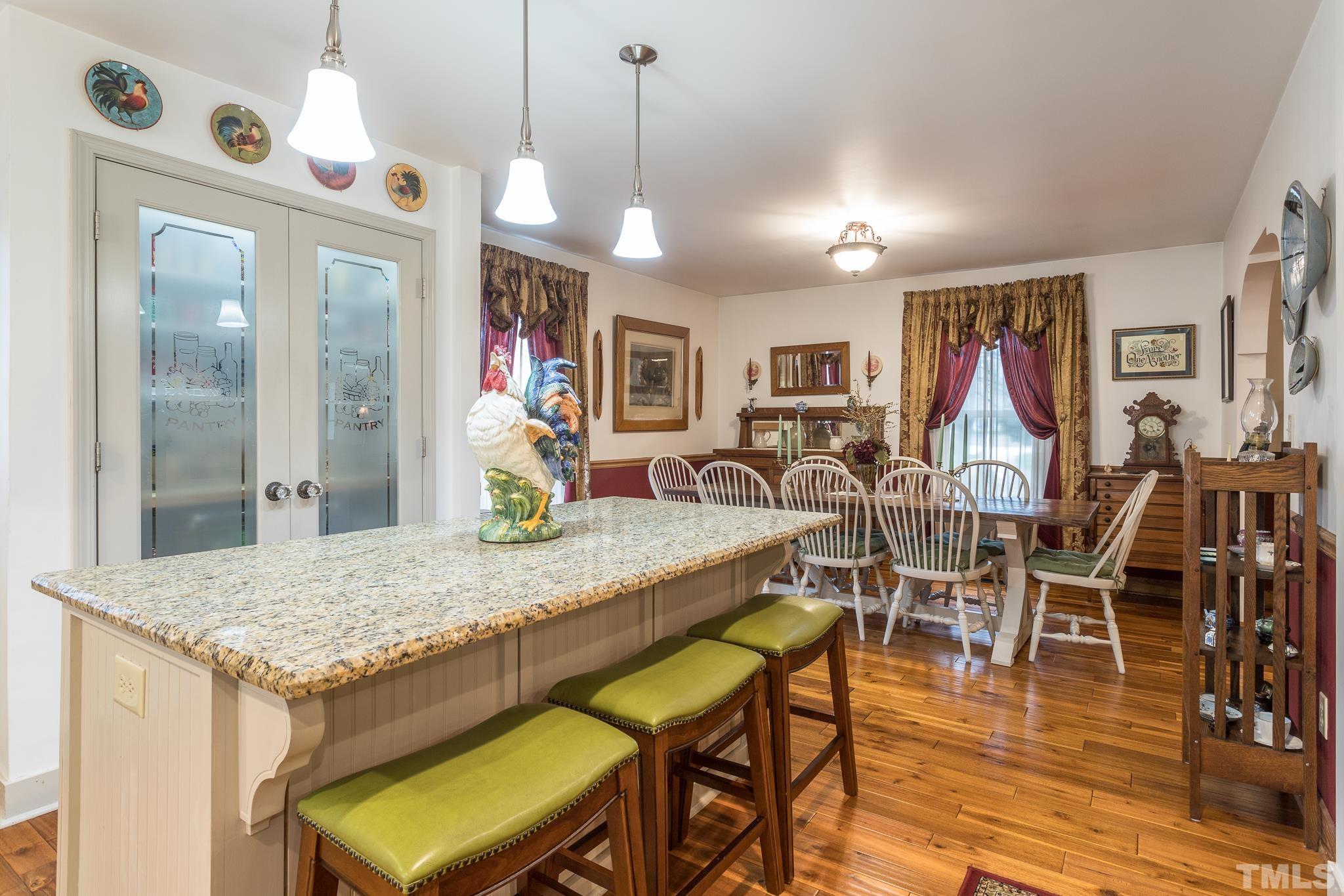 3021 Peebles Road Raleigh, NC 27616 - Photo 14 of 45 a view of a dining area with furniture
