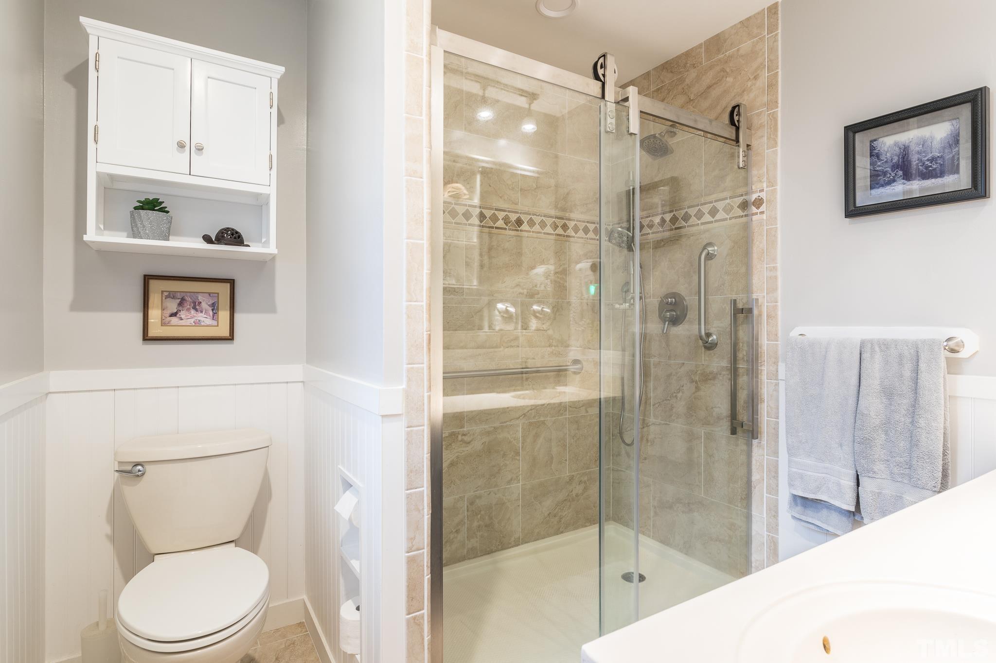 3021 Peebles Road Raleigh, NC 27616 - Photo 24 of 45 a bathroom with a shower a toilet and a sink
