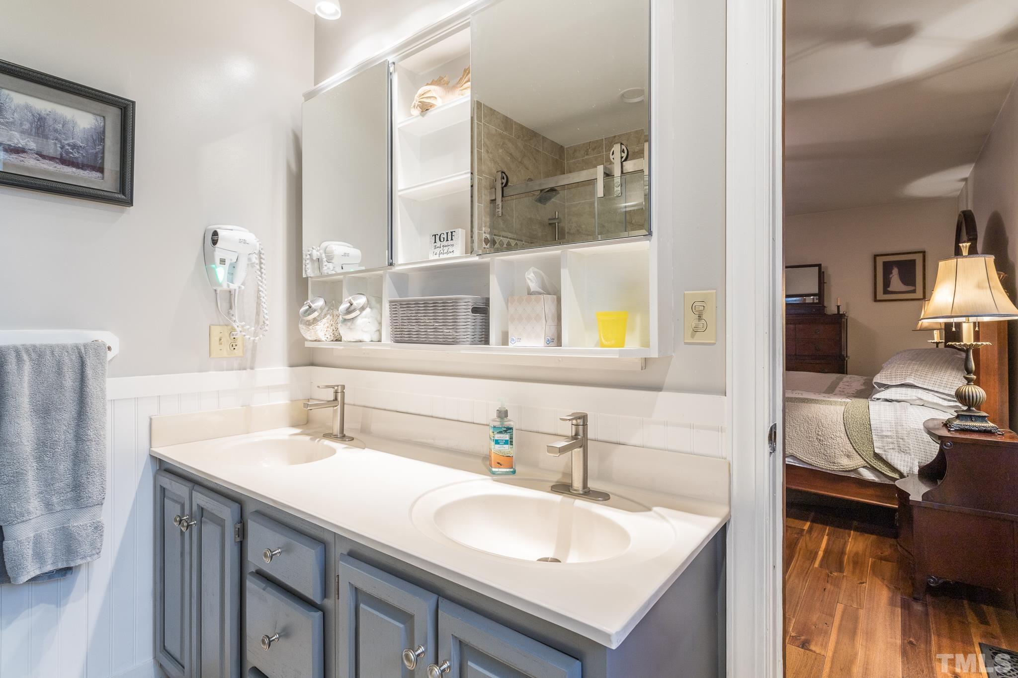 3021 Peebles Road Raleigh, NC 27616 - Photo 25 of 45 a bathroom with a sink and a mirror