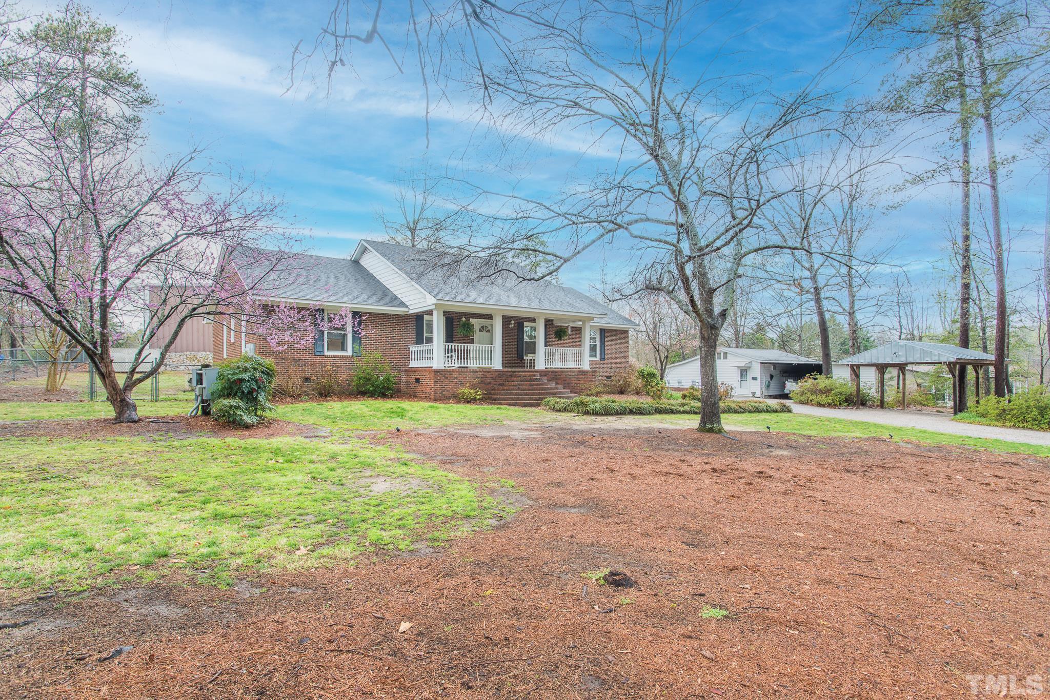 3021 Peebles Road Raleigh, NC 27616 - Photo 3 of 45 a view of a house with a yard and large trees