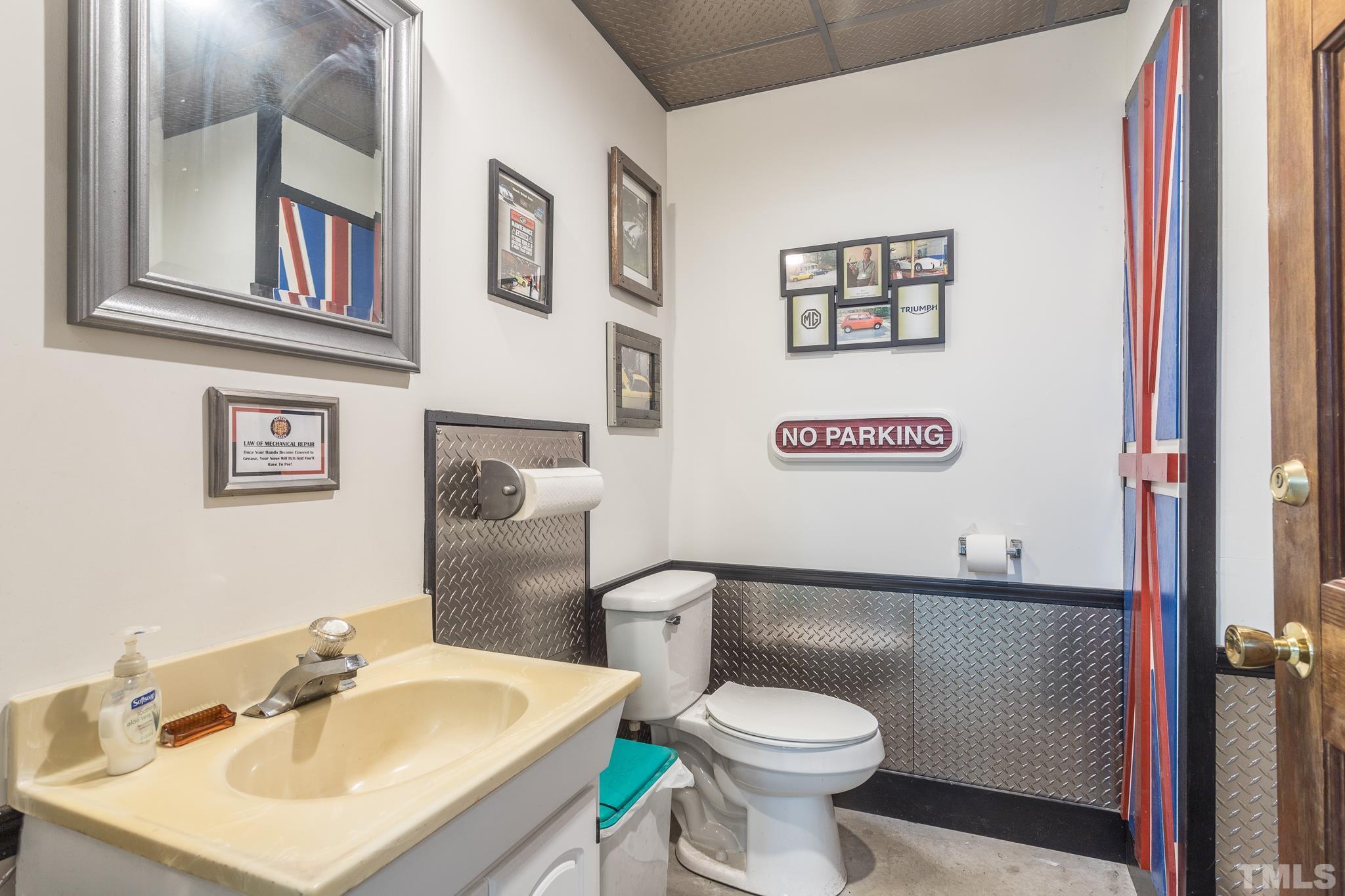 3021 Peebles Road Raleigh, NC 27616 - Photo 31 of 45 a bathroom with a sink and a toilet