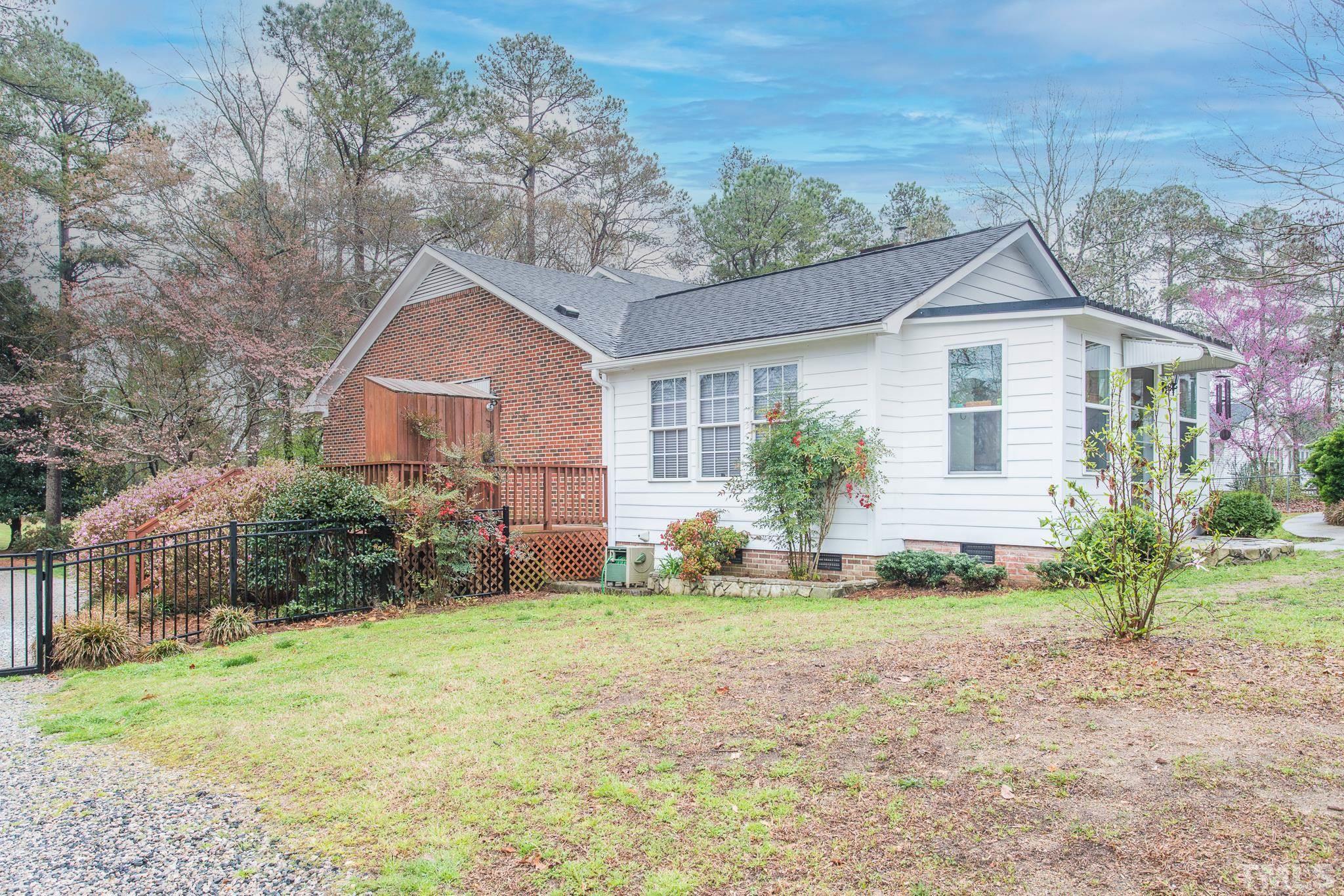 3021 Peebles Road Raleigh, NC 27616 - Photo 37 of 45 a view of a house with yard and a garden