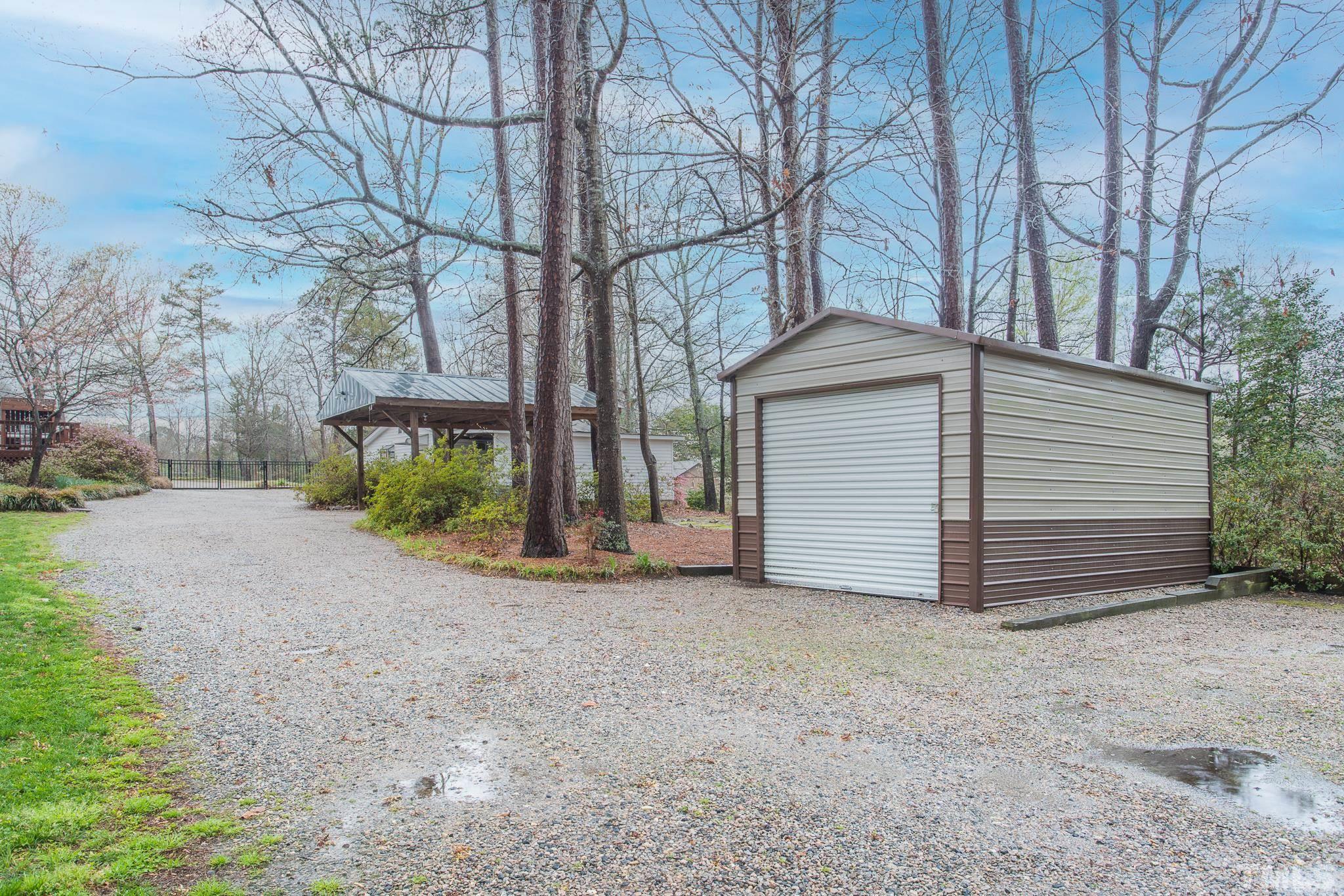 3021 Peebles Road Raleigh, NC 27616 - Photo 39 of 45 a view of a house with a yard and garage
