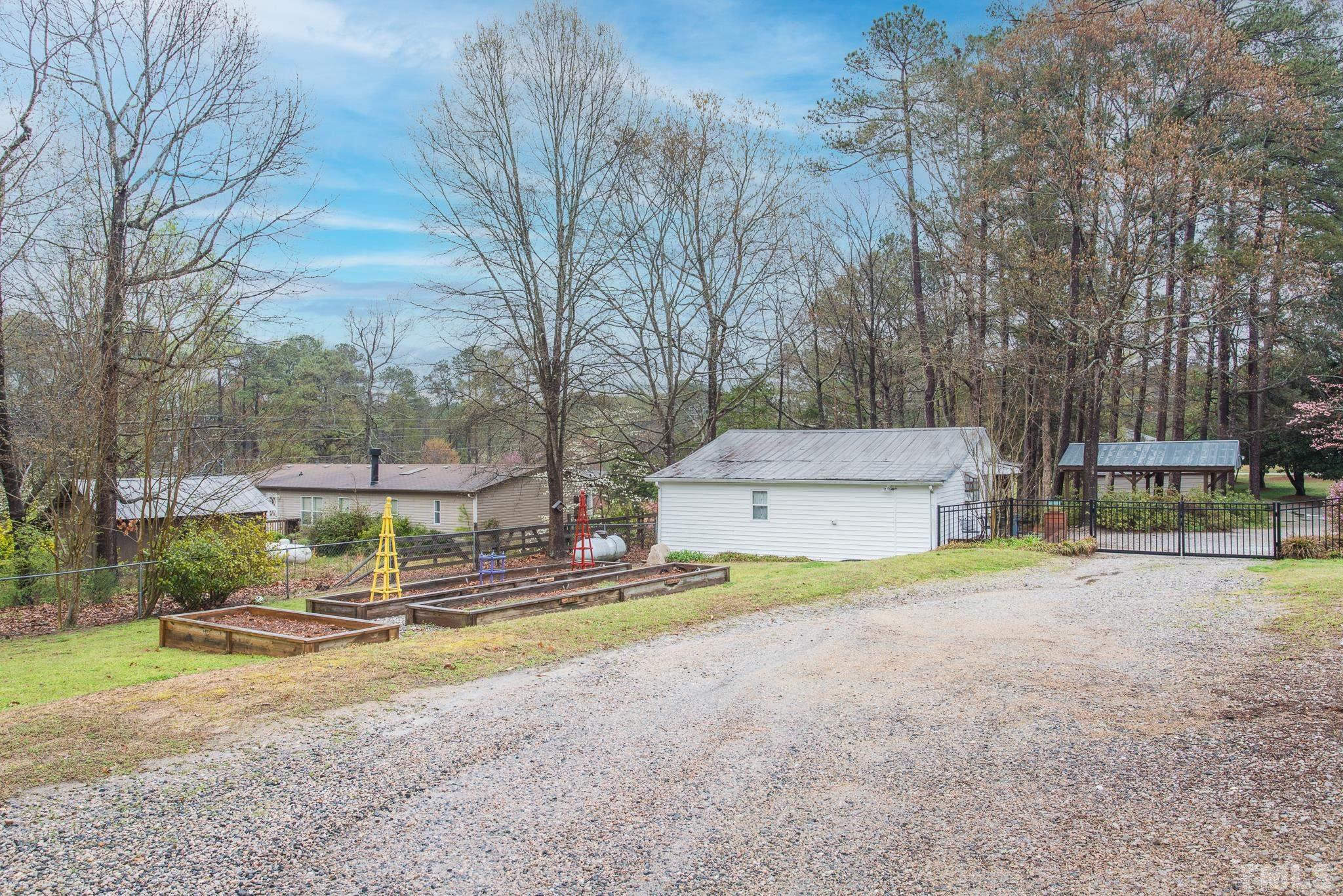 3021 Peebles Road Raleigh, NC 27616 - Photo 40 of 45 a view of a house with basketball court