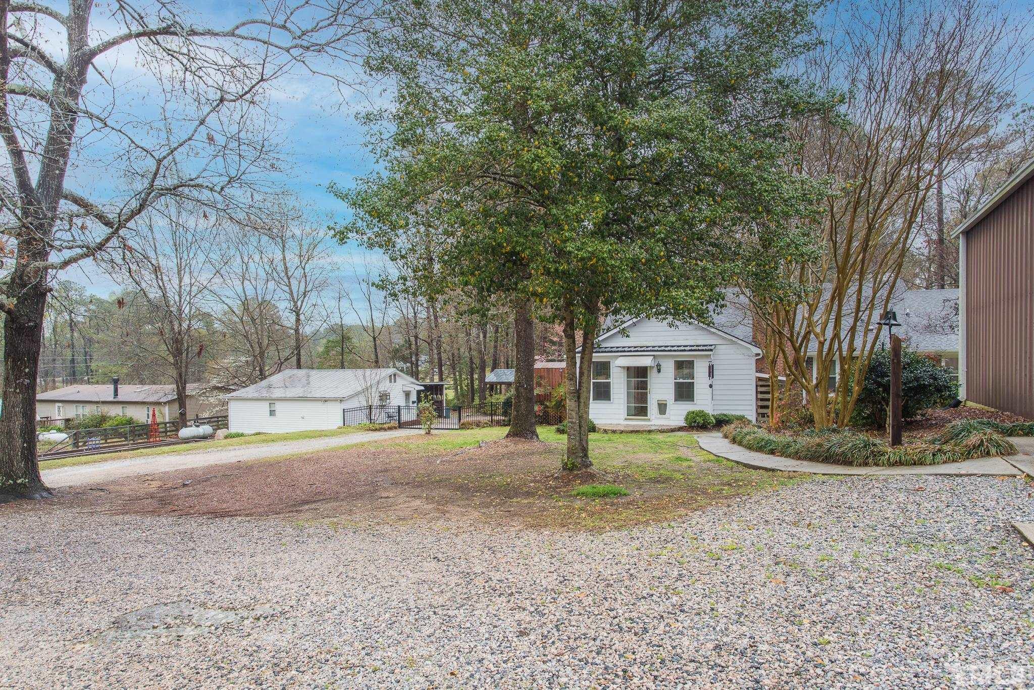 3021 Peebles Road Raleigh, NC 27616 - Photo 41 of 45 a view of a house with a yard and large trees