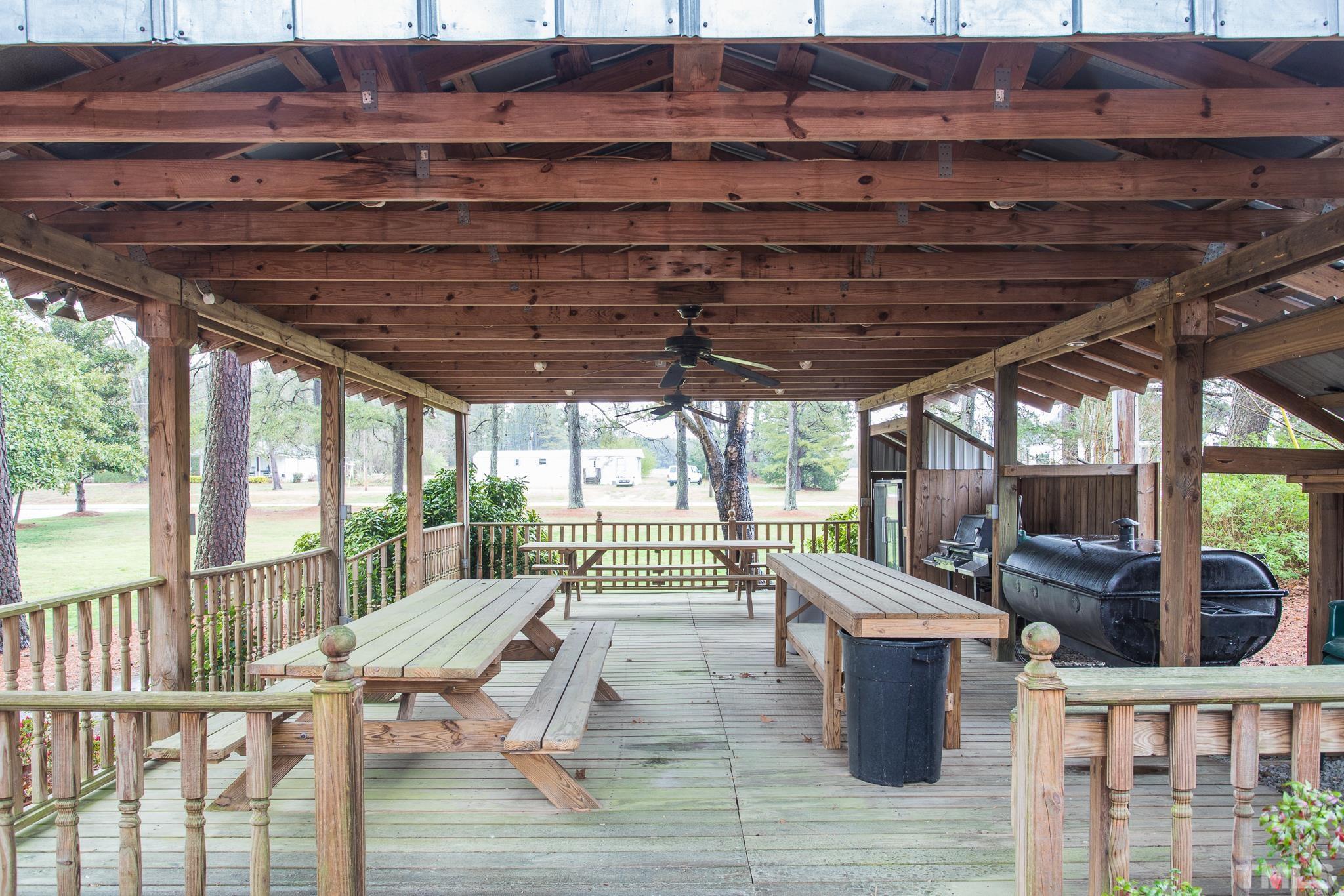 3021 Peebles Road Raleigh, NC 27616 - Photo 43 of 45 a view of a porch with furniture and wooden floor