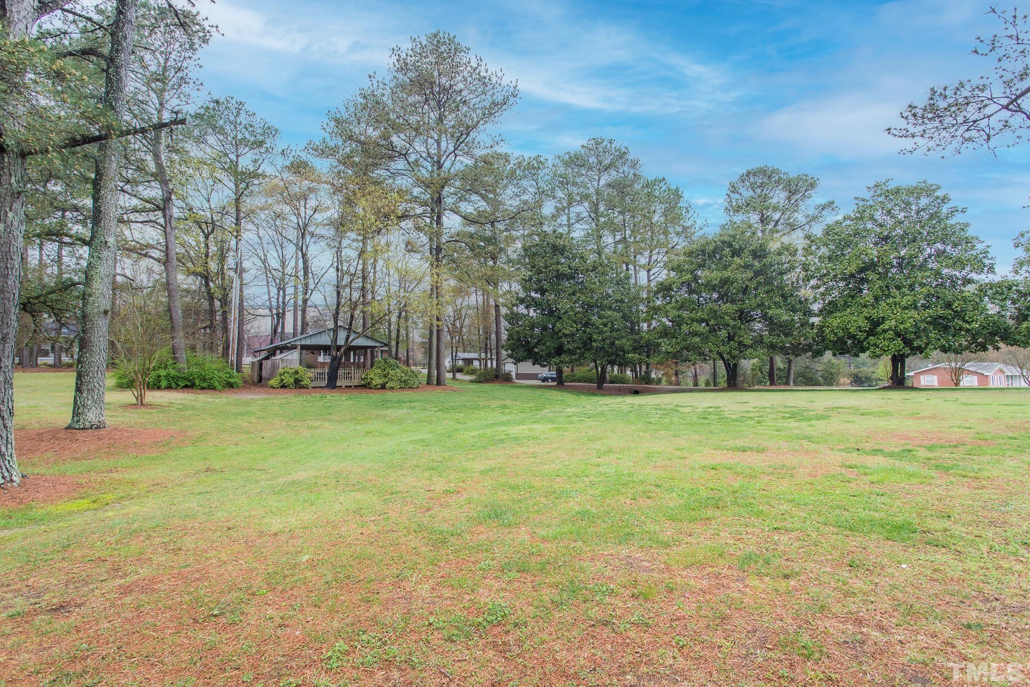 3021 Peebles Road Raleigh, NC 27616 - Photo 45 of 45 a view of a field with trees in the background