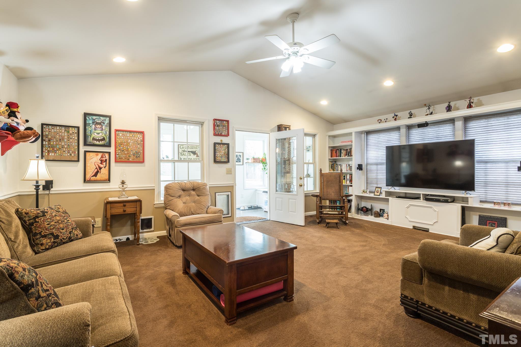 3021 Peebles Road Raleigh, NC 27616 - Photo 5 of 45 a living room with furniture and a flat screen tv