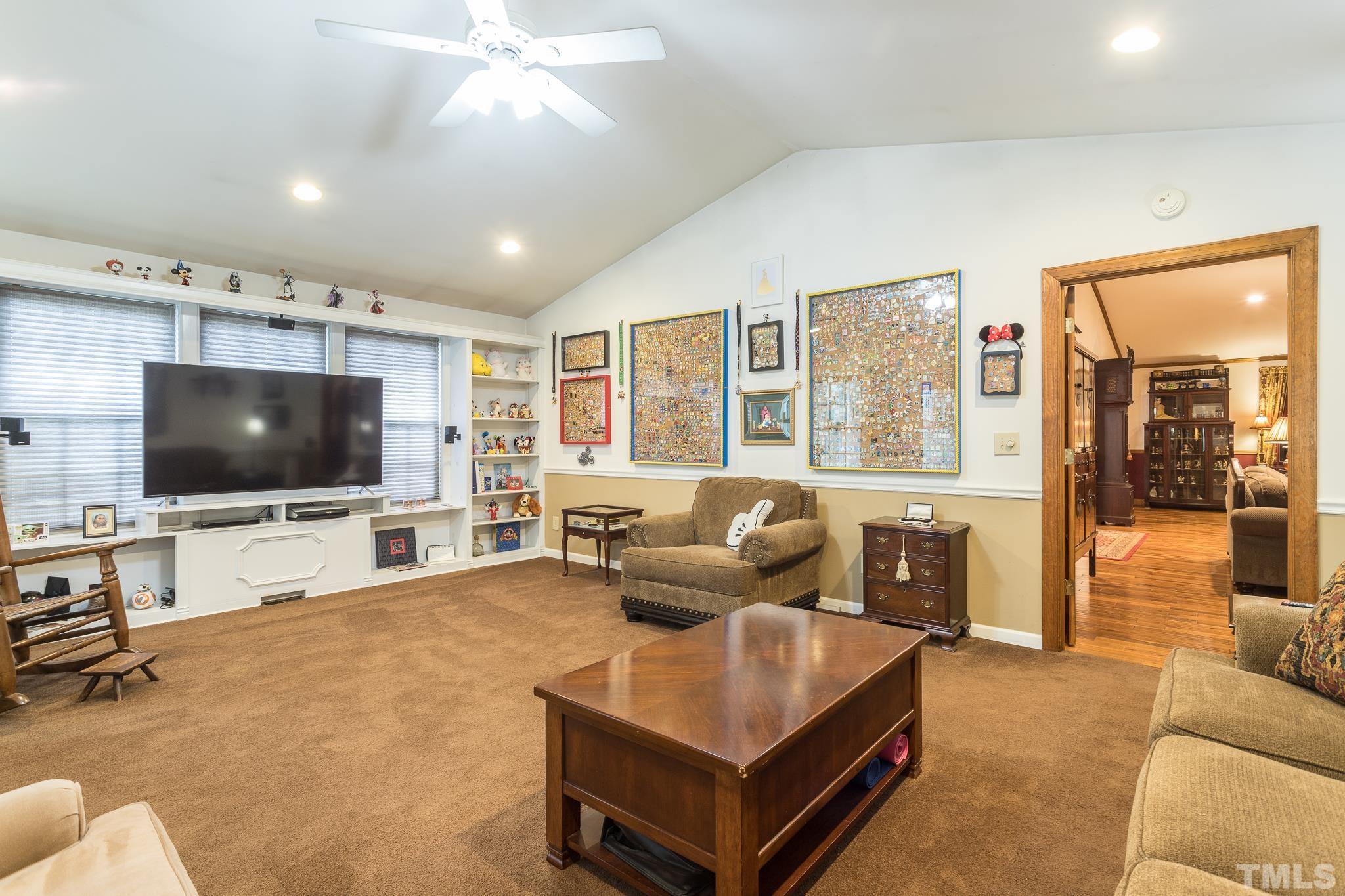 3021 Peebles Road Raleigh, NC 27616 - Photo 6 of 45 a living room with furniture and a flat screen tv