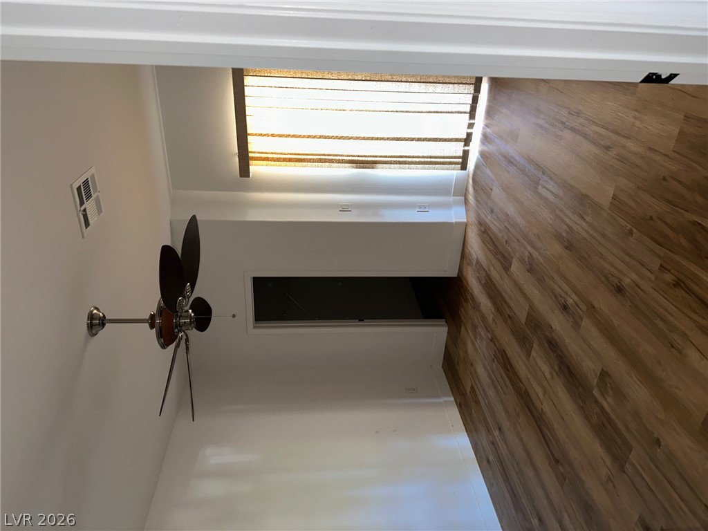 2050 West Warm Springs Road, Unit 1323 Henderson, NV 89014 - Photo 5 of 10 Rich hardwood-style flooring creates a warm and inviting atmosphere.