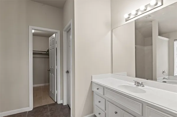 a bathroom with a sink and mirror