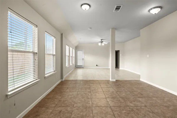 a view of a hallway with a window