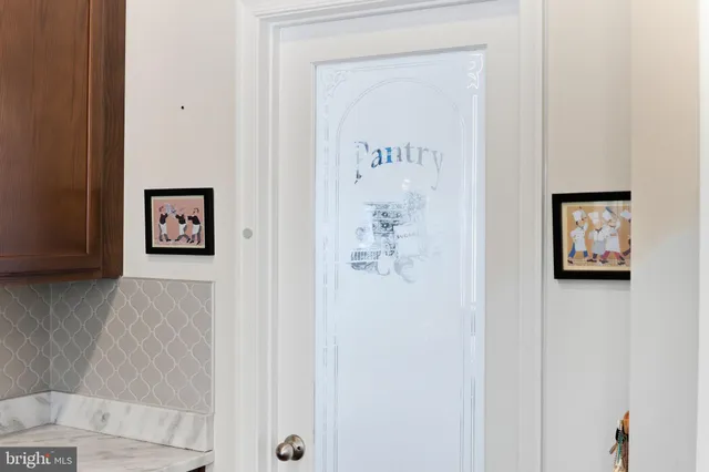 a kitchen with stainless steel appliances granite countertop a stove a refrigerator and a microwave