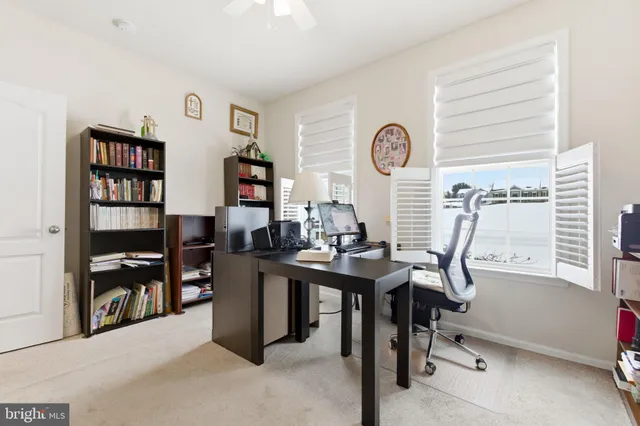 a bathroom with a sink vanity mirror and toilet