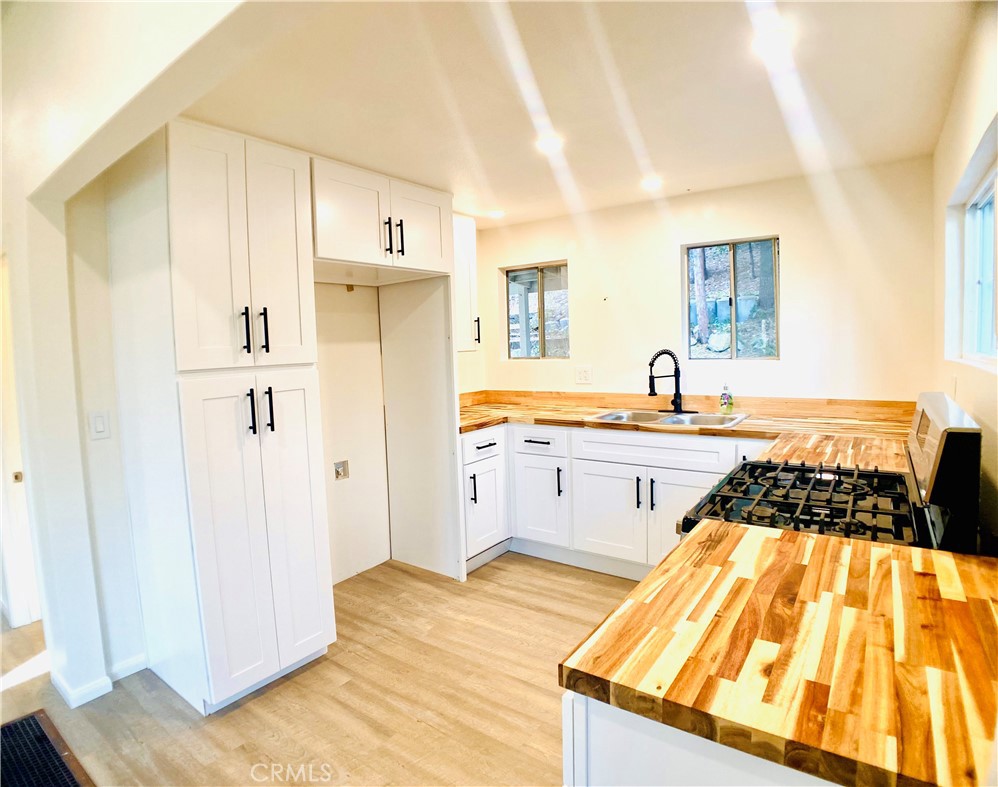 491 Willow Witch Road Cedarpines Park, CA 92322 - Photo 1 of 1 a kitchen with stainless steel appliances a refrigerator and a sink