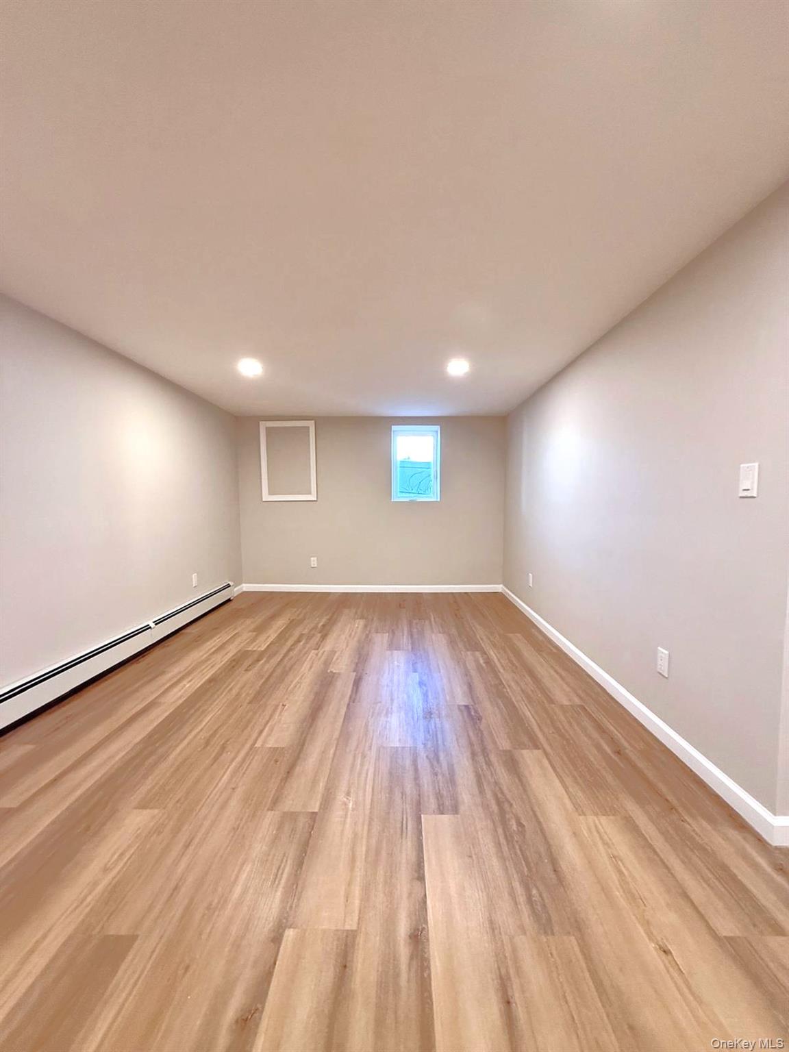 53 West Yaphank Road Medford, NY 11763 - Photo 18 of 24 a view of empty room with wooden floor
