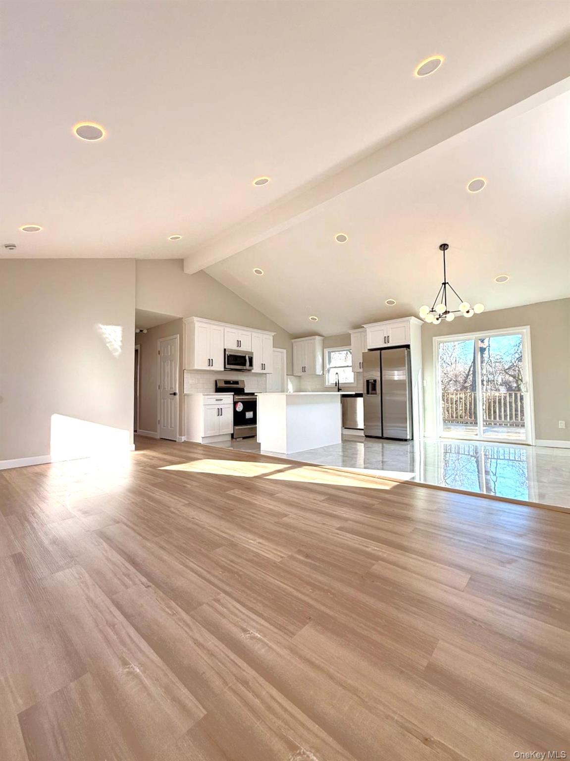 53 West Yaphank Road Medford, NY 11763 - Photo 8 of 24 a view of a kitchen with a sink and a large window
