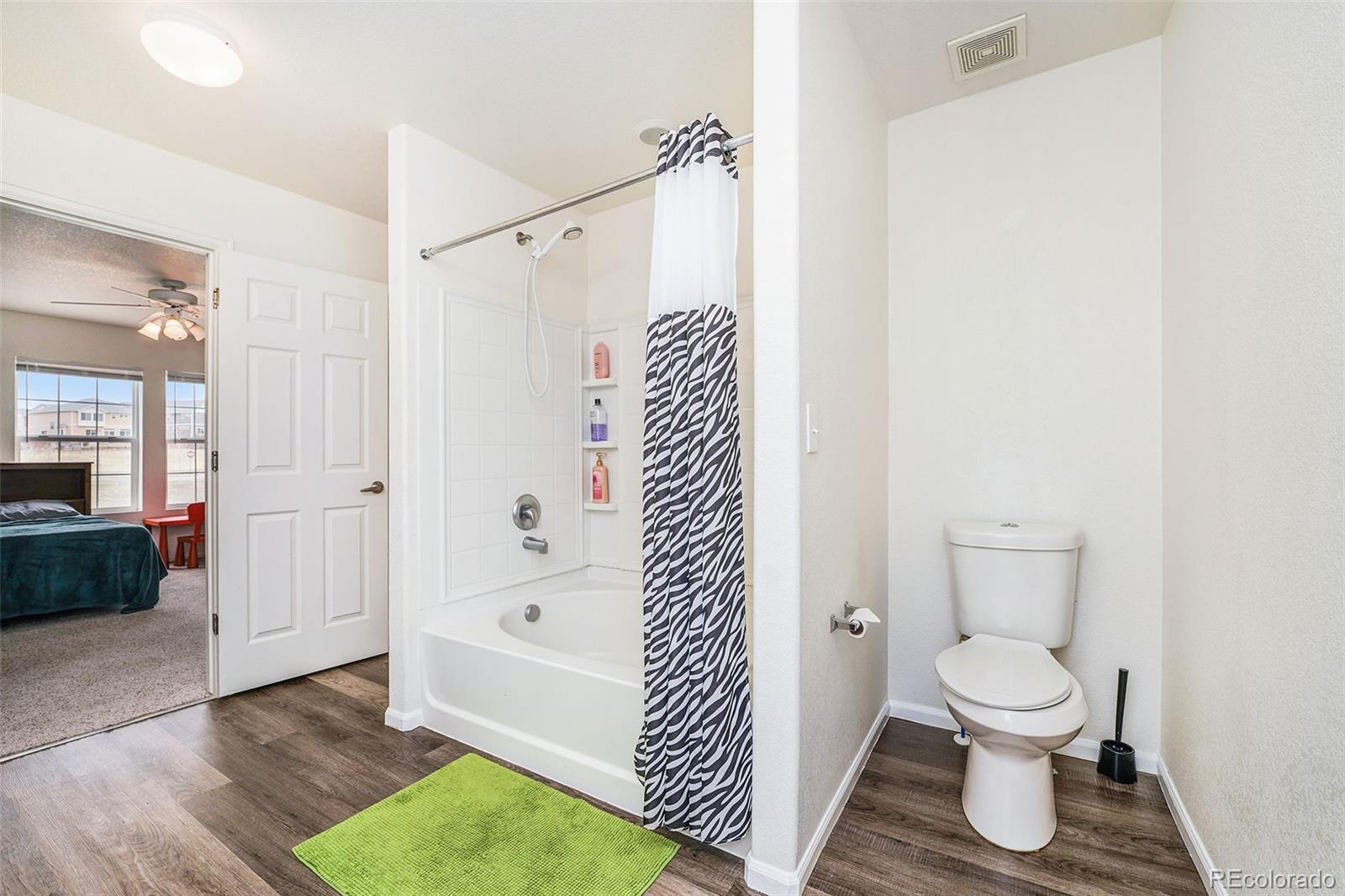 1822 Coach House Loop Castle Rock, CO 80109 - Photo 23 of 35 a bathroom with a toilet and a shower