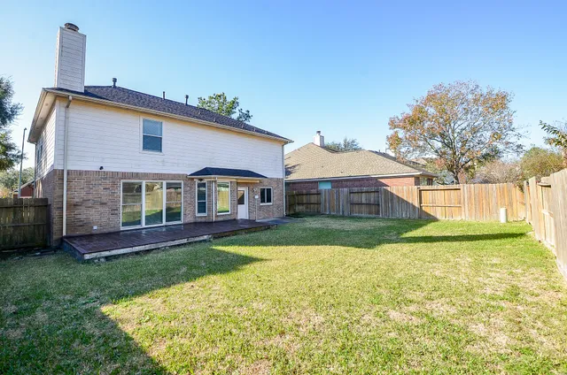 a view of a house with a yard porch and sitting area