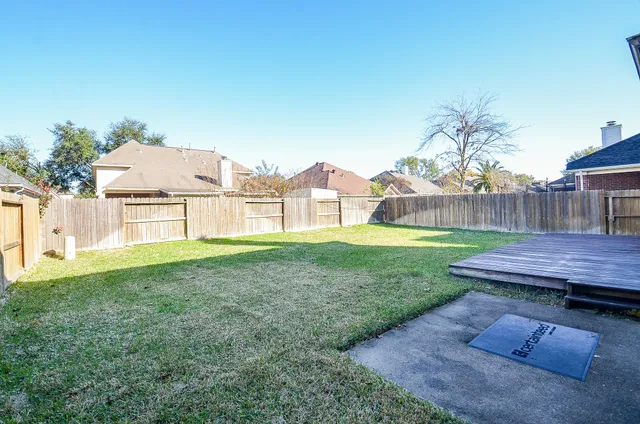 a view of a backyard with a garden and plants