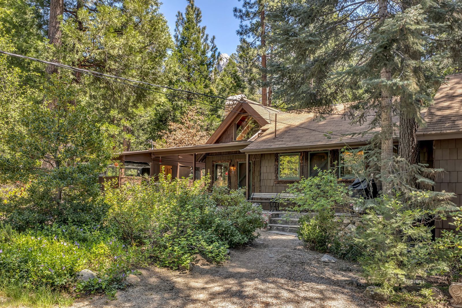 25100 Indian Rock Road Idyllwild, CA 92549 - Photo 65 of 75 a front view of a house with a yard