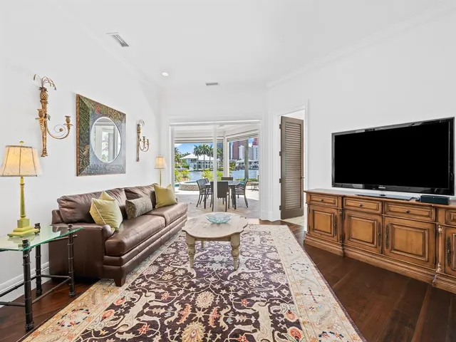 a view of a house with swimming pool and sitting area