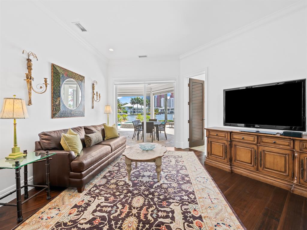 2898 Northeast 26th Street Fort Lauderdale, FL 33305 - Photo 21 of 77 a living room with furniture and a flat screen tv