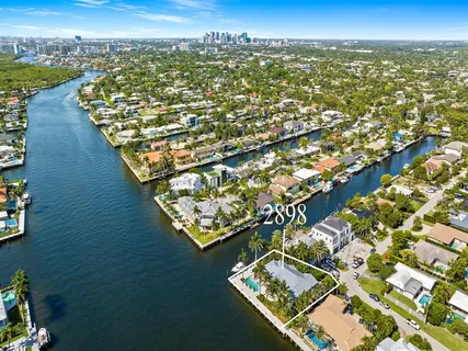 an aerial view of a house with a ocean view