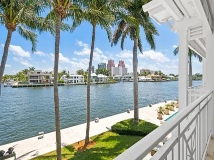 a view of a house with swimming pool and porch with furniture