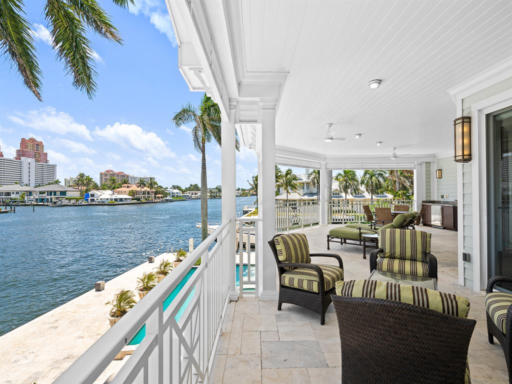 2898 Northeast 26th Street Fort Lauderdale, FL 33305 - Photo 46 of 77 a balcony with furniture and a lake view