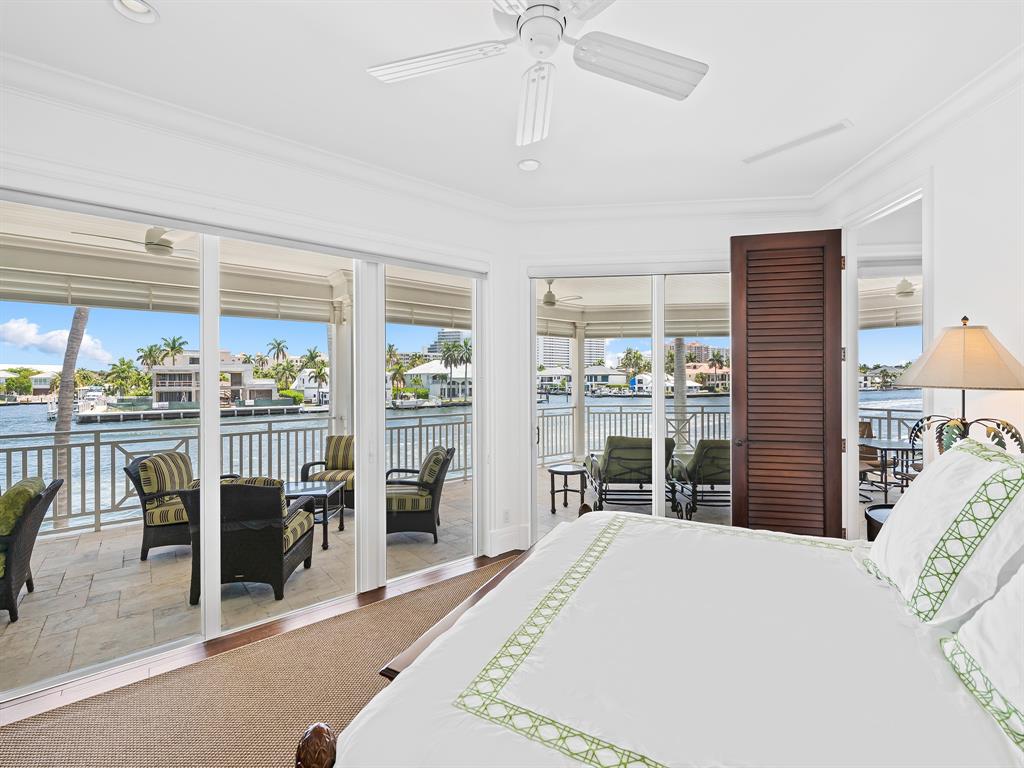 2898 Northeast 26th Street Fort Lauderdale, FL 33305 - Photo 53 of 77 a bedroom with a large bed and a large window