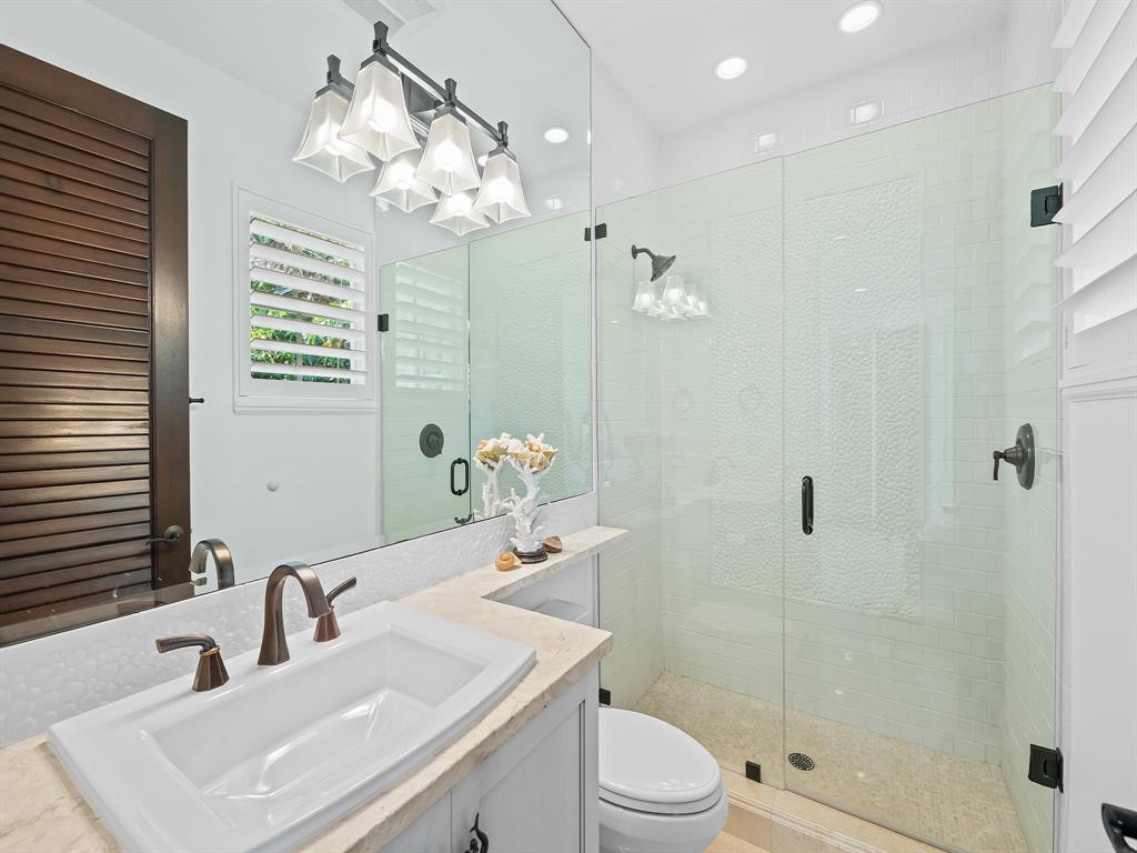 2898 Northeast 26th Street Fort Lauderdale, FL 33305 - Photo 57 of 77 a bathroom with a sink a toilet and shower