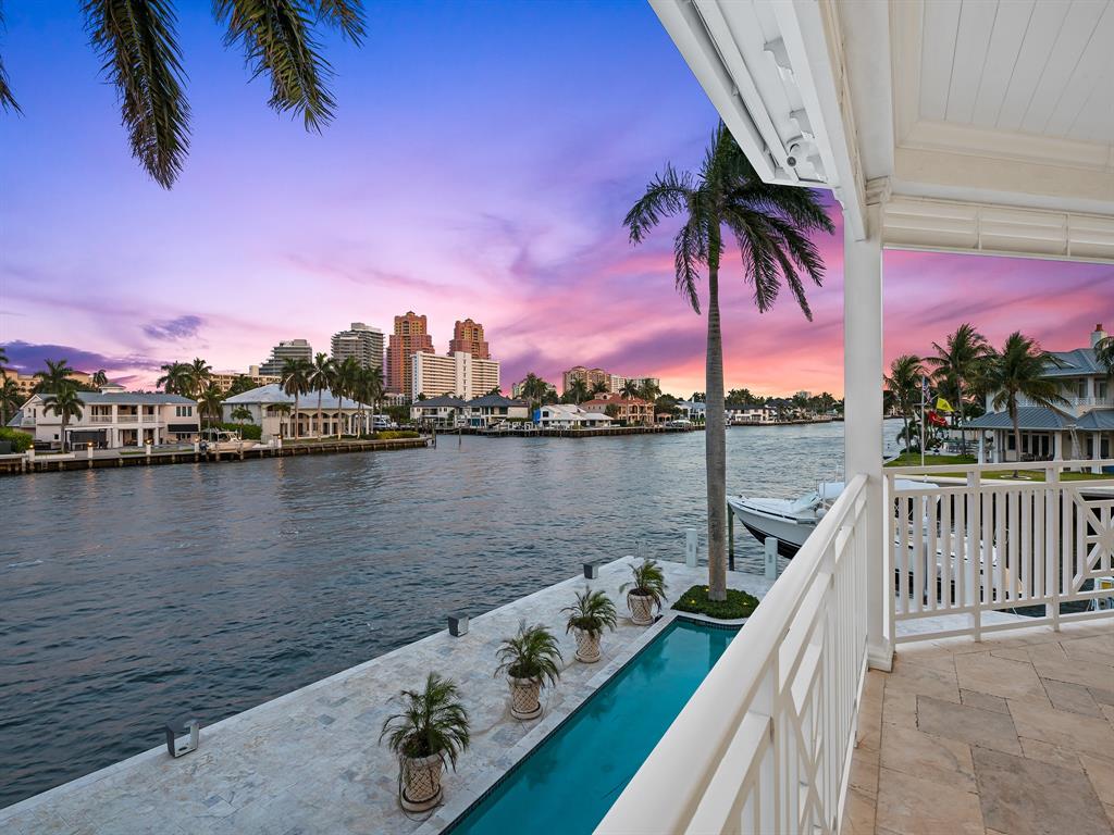 2898 Northeast 26th Street Fort Lauderdale, FL 33305 - Photo 74 of 77 a view of a lake with a table and chairs