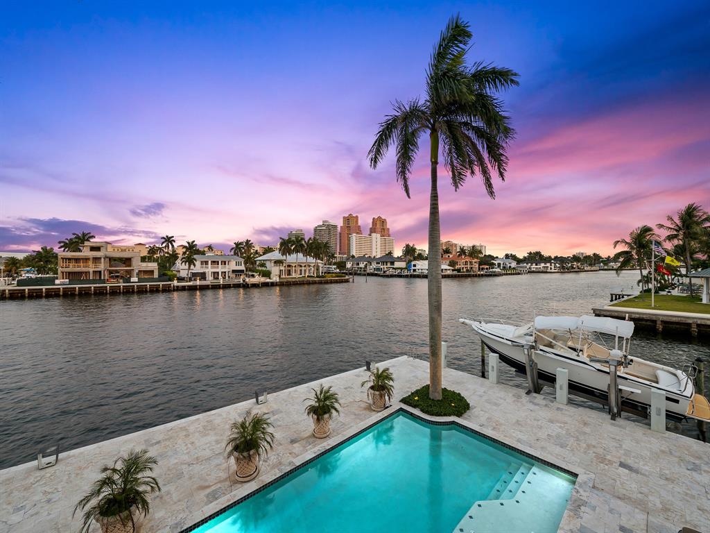 2898 Northeast 26th Street Fort Lauderdale, FL 33305 - Photo 76 of 77 a view of a lake with a table and chairs