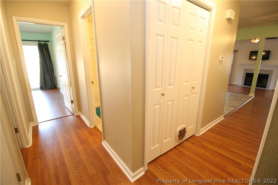 6241 Stoney Point Loop Fayetteville, NC 28306 - Photo 19 of 40 a view of a hallway with wooden floor and staircase
