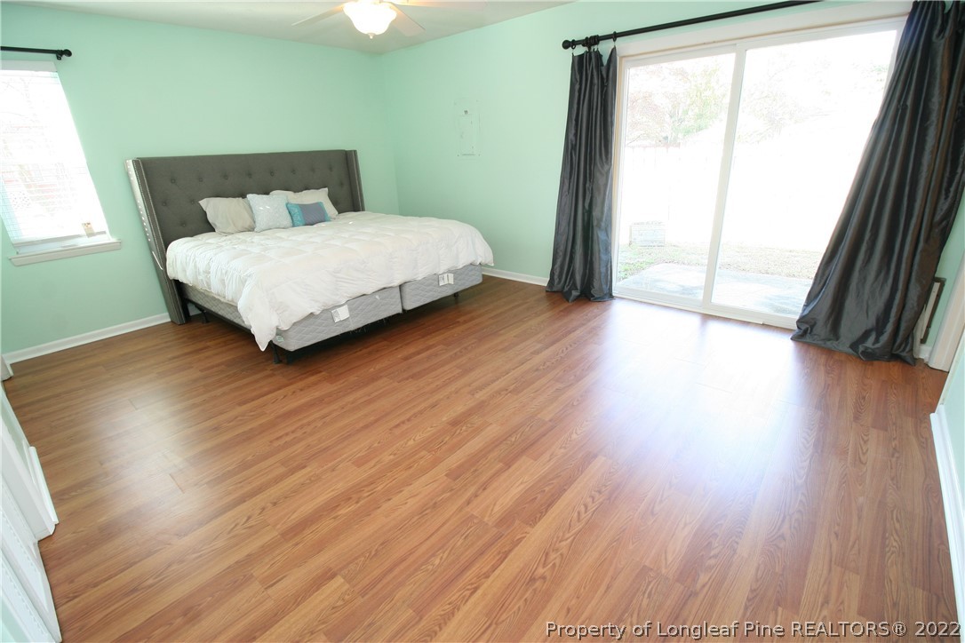 6241 Stoney Point Loop Fayetteville, NC 28306 - Photo 20 of 40 a bedroom with a bed and a large window