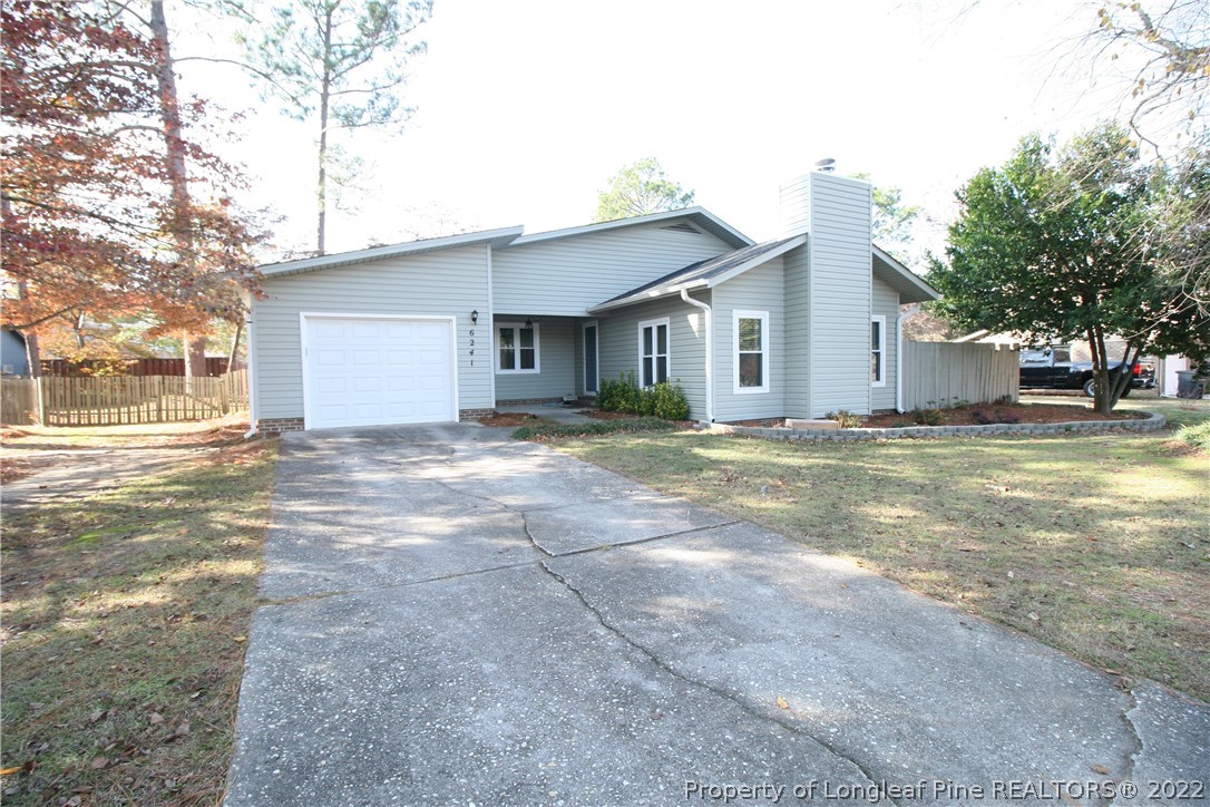 6241 Stoney Point Loop Fayetteville, NC 28306 - Photo 2 of 40 a view of a house with a yard