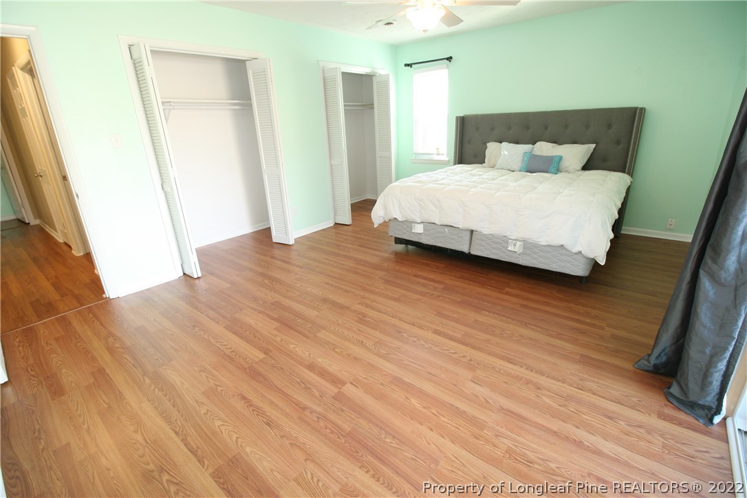 6241 Stoney Point Loop Fayetteville, NC 28306 - Photo 21 of 40 a bedroom with a bed and a mirror