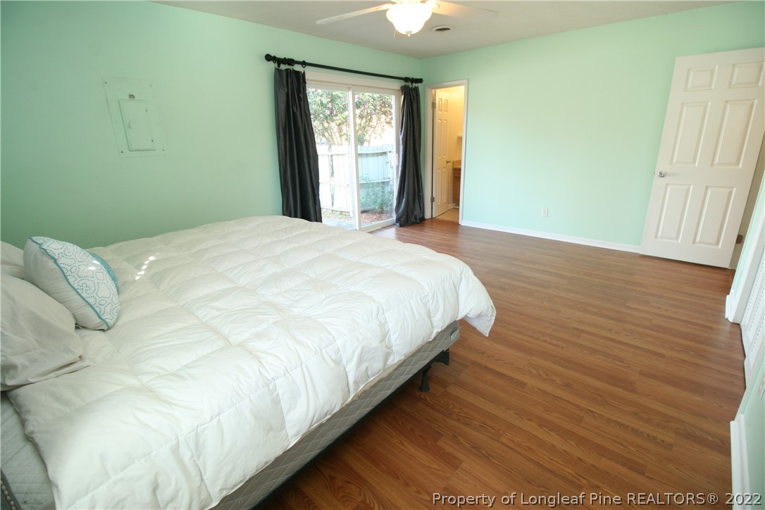 6241 Stoney Point Loop Fayetteville, NC 28306 - Photo 23 of 40 a large bed sitting in a bedroom next to a window