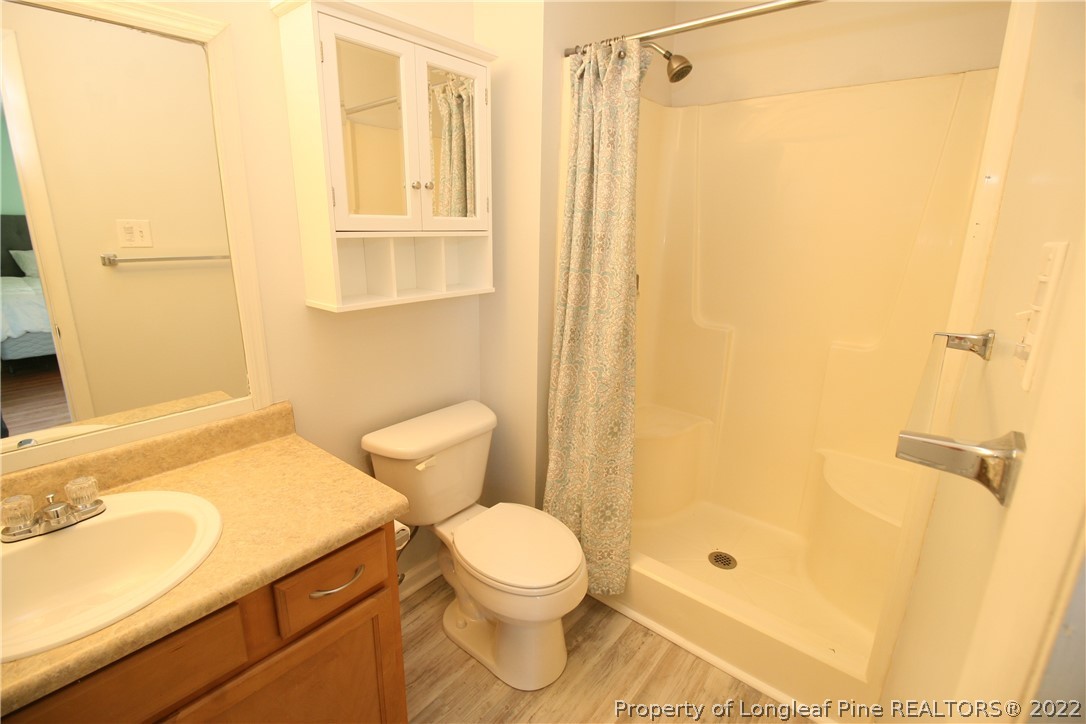 6241 Stoney Point Loop Fayetteville, NC 28306 - Photo 24 of 40 a bathroom with a sink toilet and shower