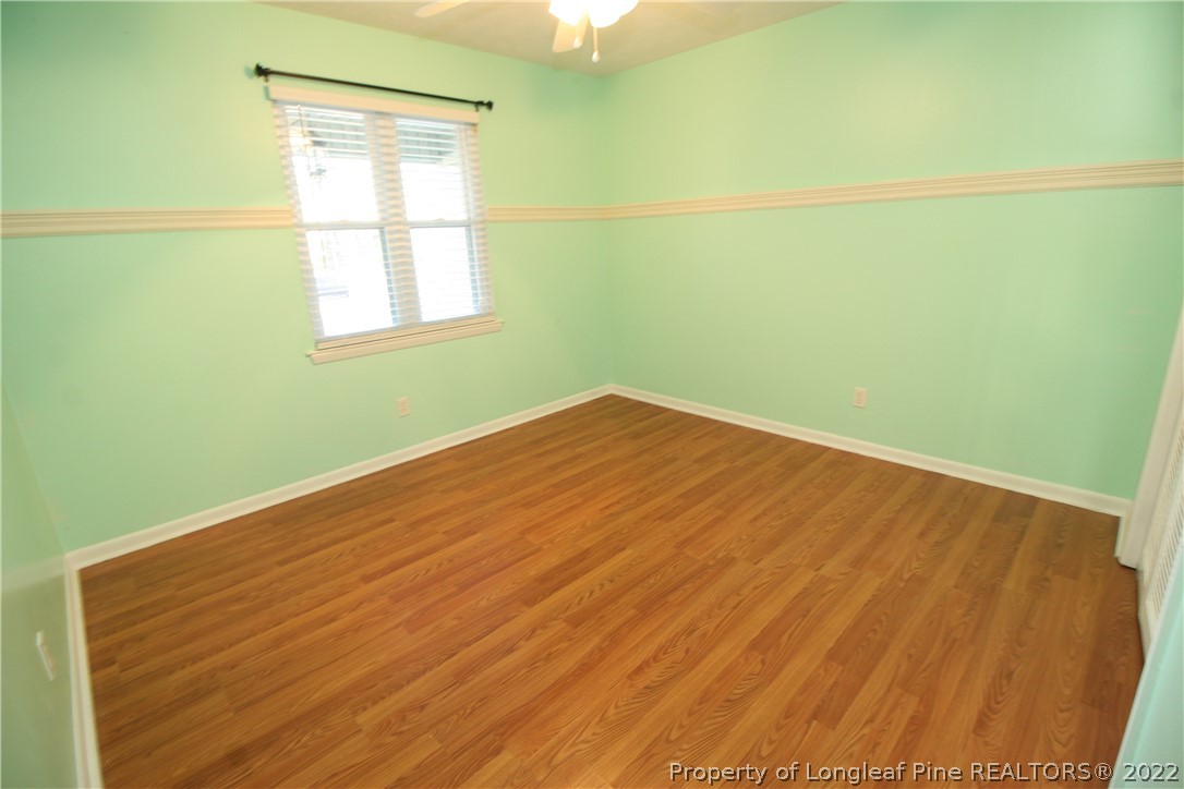 6241 Stoney Point Loop Fayetteville, NC 28306 - Photo 29 of 40 a view of a room with a wooden floor and a window