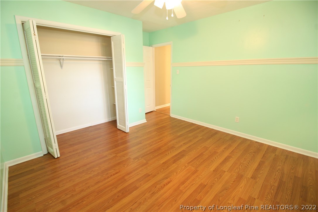 6241 Stoney Point Loop Fayetteville, NC 28306 - Photo 30 of 40 an empty room with wooden floor and a window