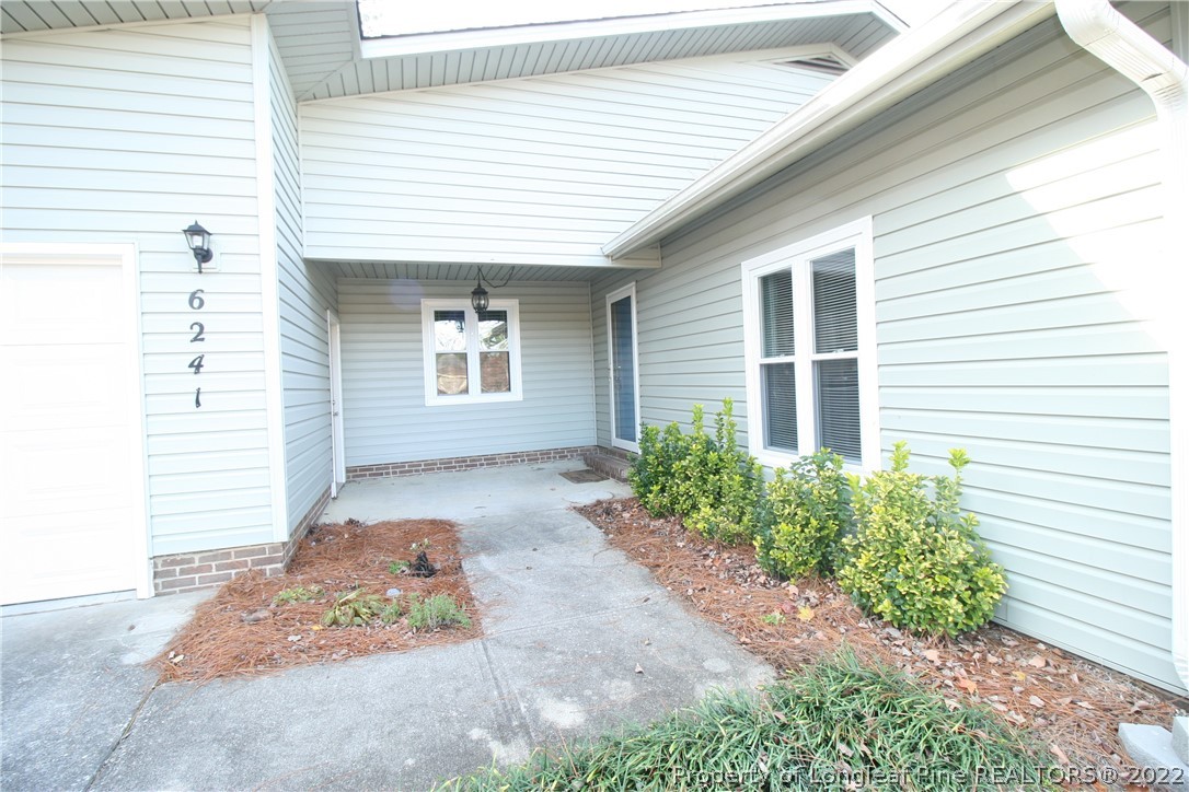 6241 Stoney Point Loop Fayetteville, NC 28306 - Photo 3 of 40 a front view of a house with garden