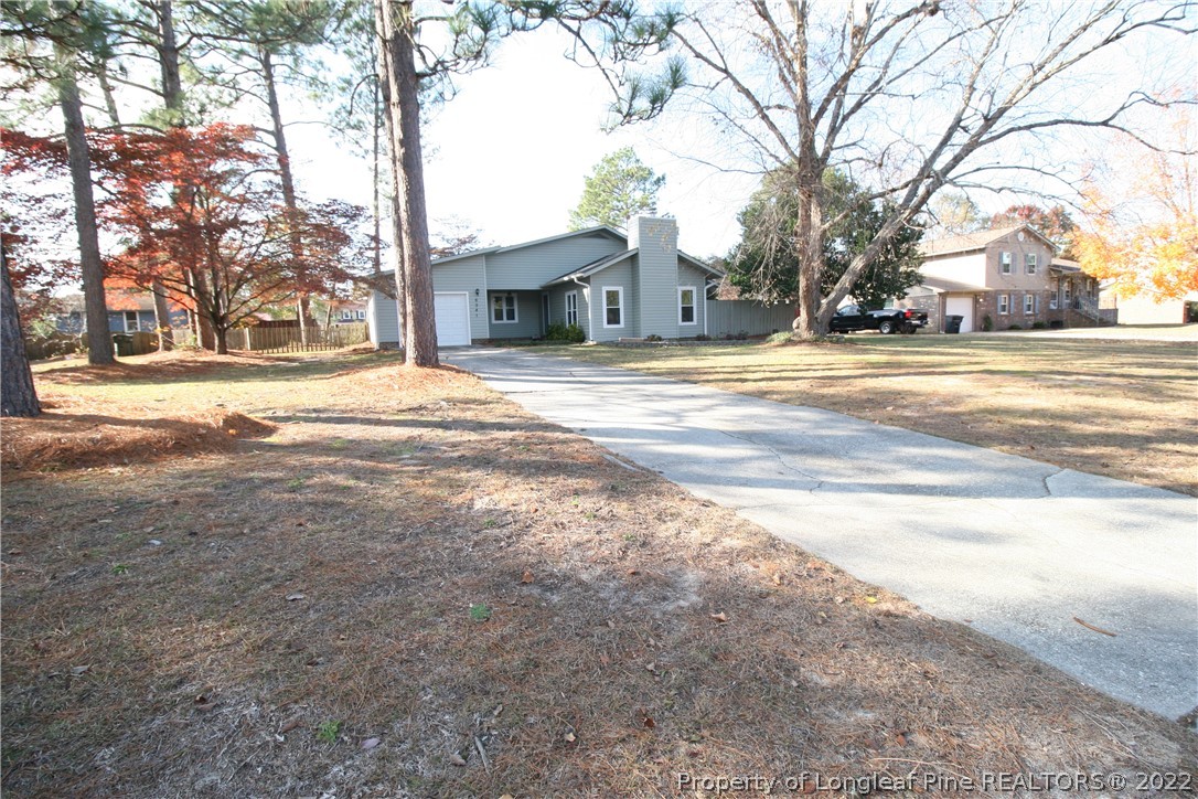 6241 Stoney Point Loop Fayetteville, NC 28306 - Photo 32 of 40 a house with trees in front of it