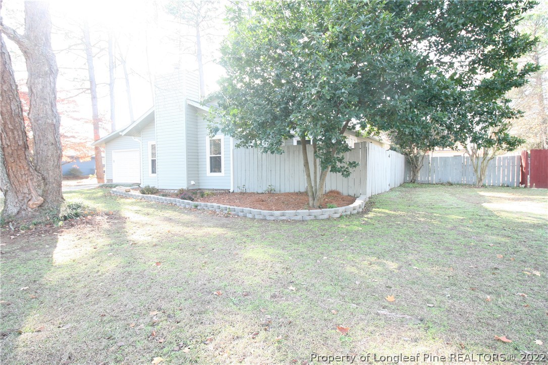 6241 Stoney Point Loop Fayetteville, NC 28306 - Photo 39 of 40 a view of a house with a yard