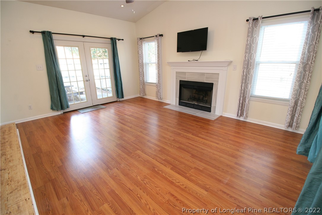 6241 Stoney Point Loop Fayetteville, NC 28306 - Photo 6 of 40 a view of an empty room with wooden floor and a window