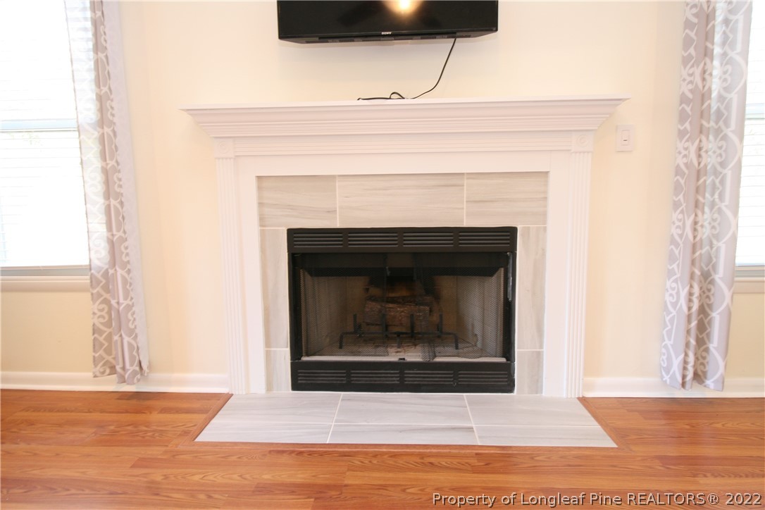 6241 Stoney Point Loop Fayetteville, NC 28306 - Photo 7 of 40 a living room with a fireplace
