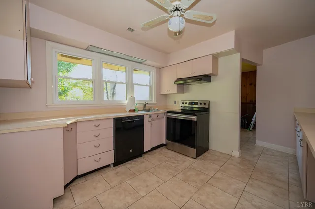 a kitchen with a stove a sink and a refrigerator