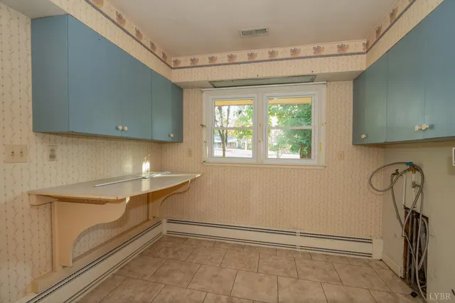 a room with gym equipment and a window