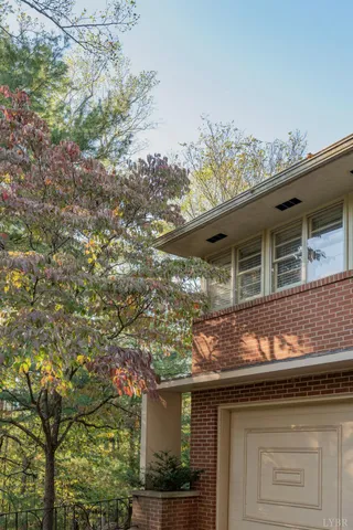 a house that has tree in front of it